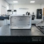 Precision CNC milled aluminum prototype enclosure inspected on granite surface plate - AS Prototypes