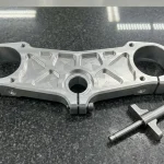 Billet 7075-T6 Aluminum Custom Motorcycle Triple Clamp Resting Flat on Granite Surface Plate with Micrometer