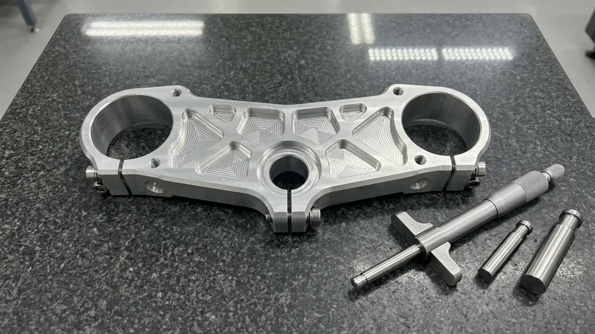 Billet 7075-T6 Aluminum Custom Motorcycle Triple Clamp Resting Flat on Granite Surface Plate with Micrometer