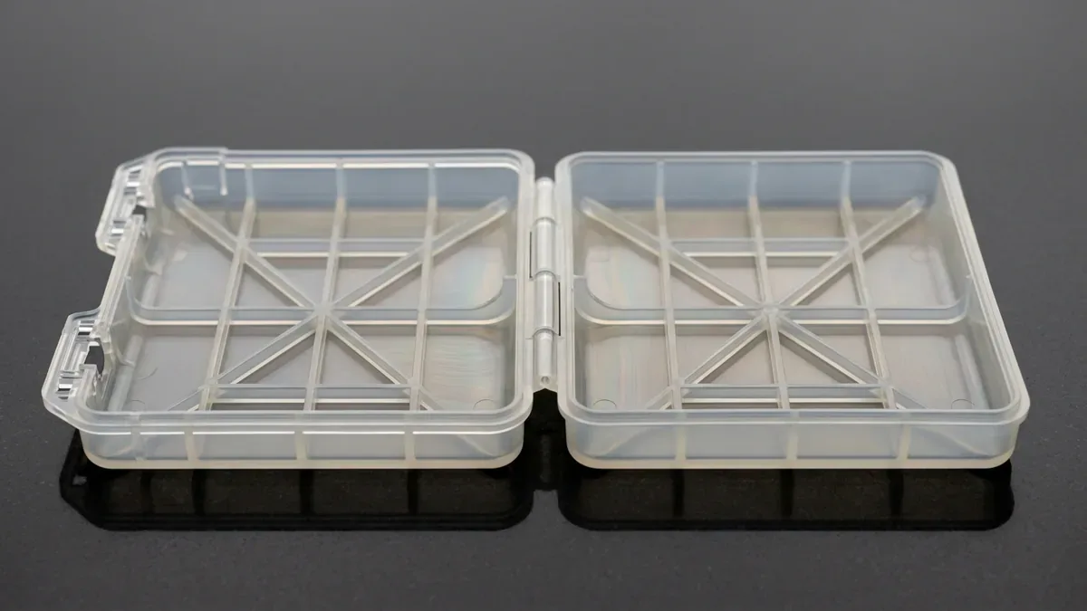 Precision injection molded polypropylene component featuring an integrated flexible living hinge