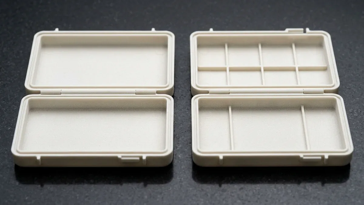 SLS 3D-printed natural off-white PA12 nylon functional clamshell housings with 0.8mm flexible living hinge bridges
