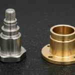 CNC-turned 17-4PH stainless steel stepped actuator shaft with hex flange and C3604 brass flanged bearing sleeve