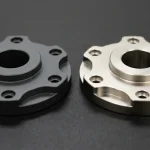 Hardcoat anodized 7075-T6 aluminum and electroless nickel plated 4140 steel rotary adapter flanges comparing surface finishes