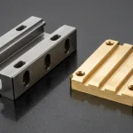 Plain milled 4140 alloy steel linear guide block and C3604 brass slotted locator block with parallel channels