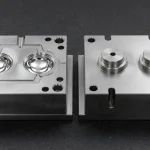 Hardened S136 tool steel injection mold cavity and core blocks showing SPI A-1 diamond mirror polish