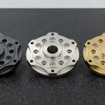 CNC machined 6061-T6 aluminum 4140 steel and 17-4PH rotary adapter flanges showing hardcoat anodize ENP and TiN PVD finishes